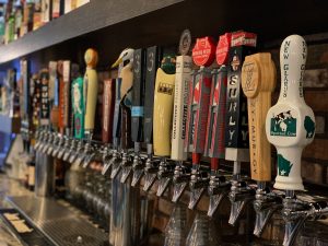 Experience River Falls Bars - Juniors Restaurant and Tap House - Image of taps