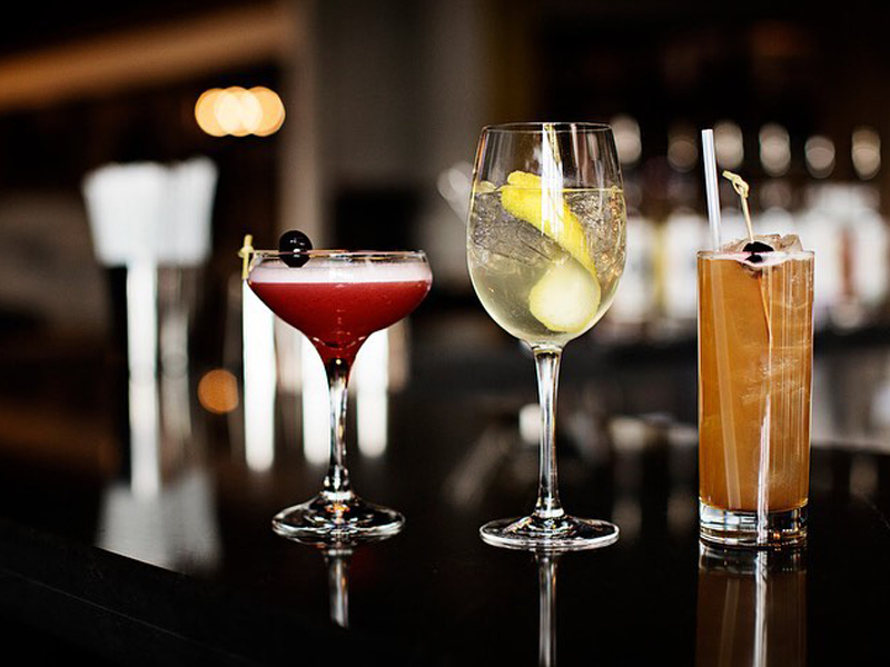 Experience River Falls Craft Beverages - Mixed Drinks at Tattersall. Three drinks on the bar